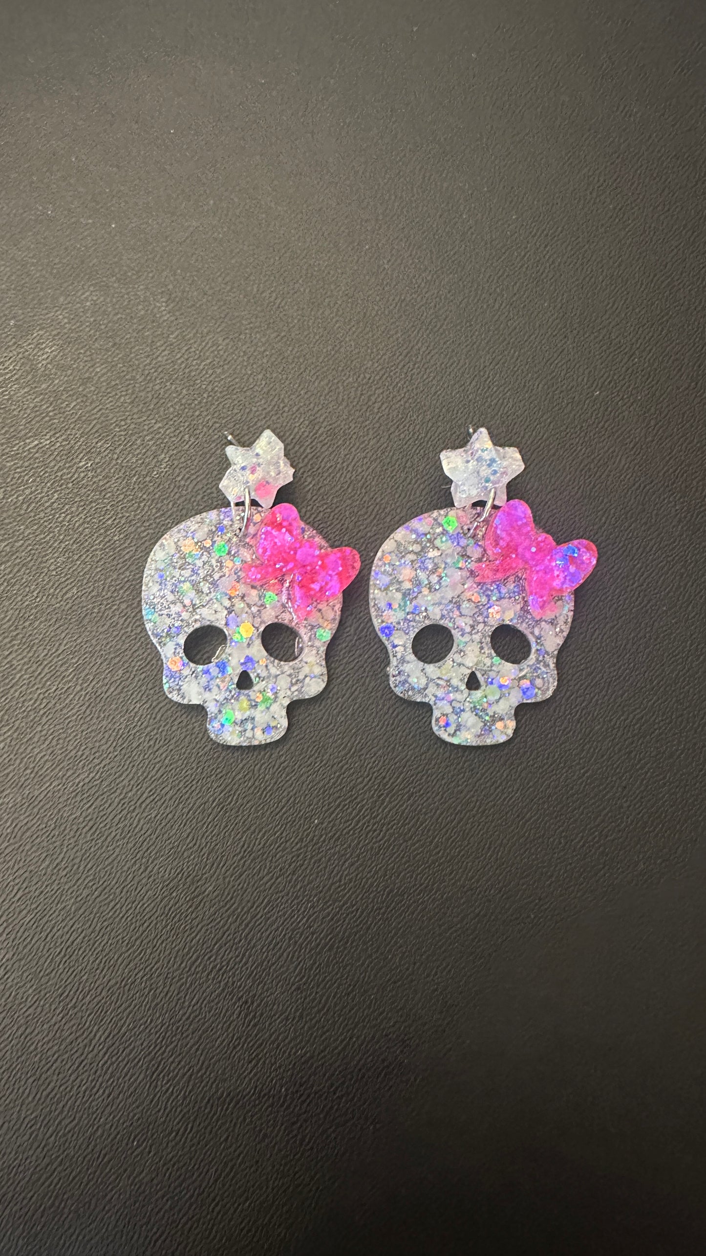 Handmade glow in the dark skull bow earrings